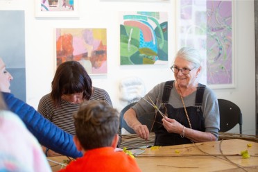 Willow Weaving workshop 2 women facing camera back of childs head Mermaid Gallery
